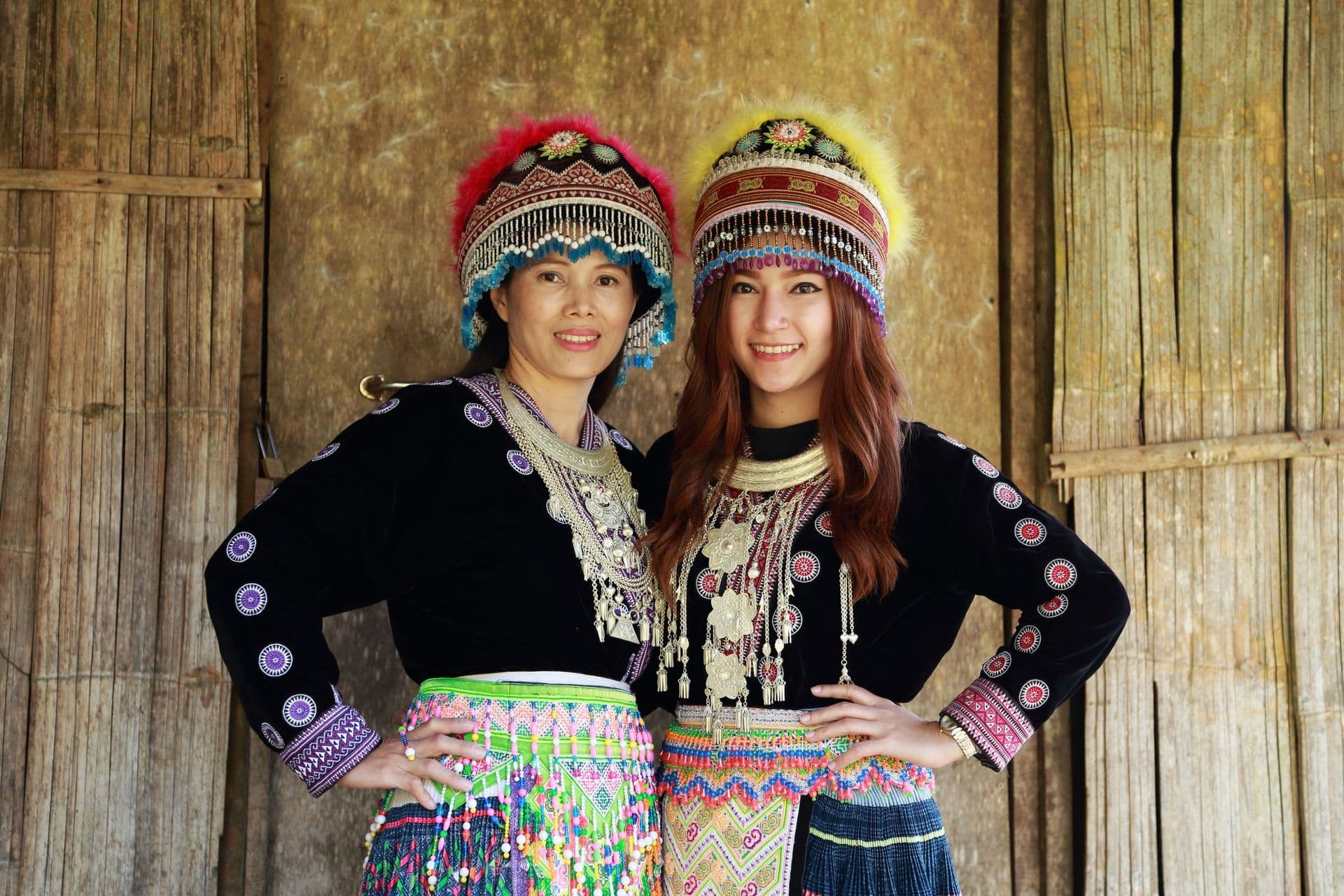 Traditionally dressed Mhong hill tribe woman in the wooden cottage